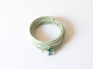 Spiral multi-strand rigid bracelet in silk with fluorite, apatite and keshi pearls