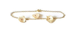 Golden silver bracelet with keshi pearls and red tourmaline