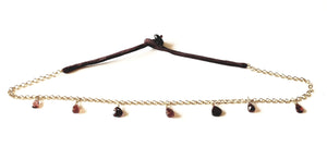 Golden silver and silk necklace with garnet